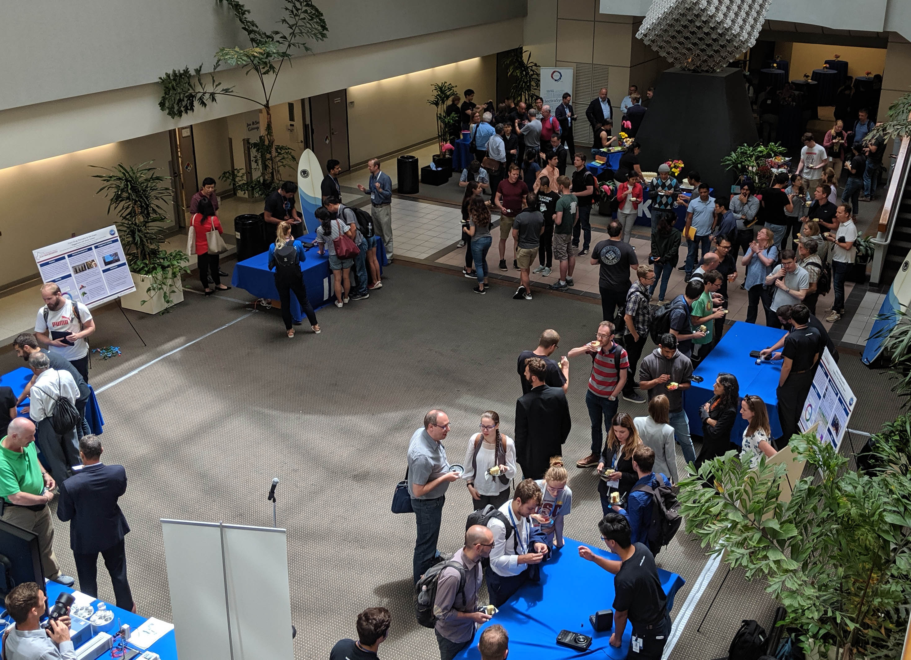 people gathered around booths at ACS meeting